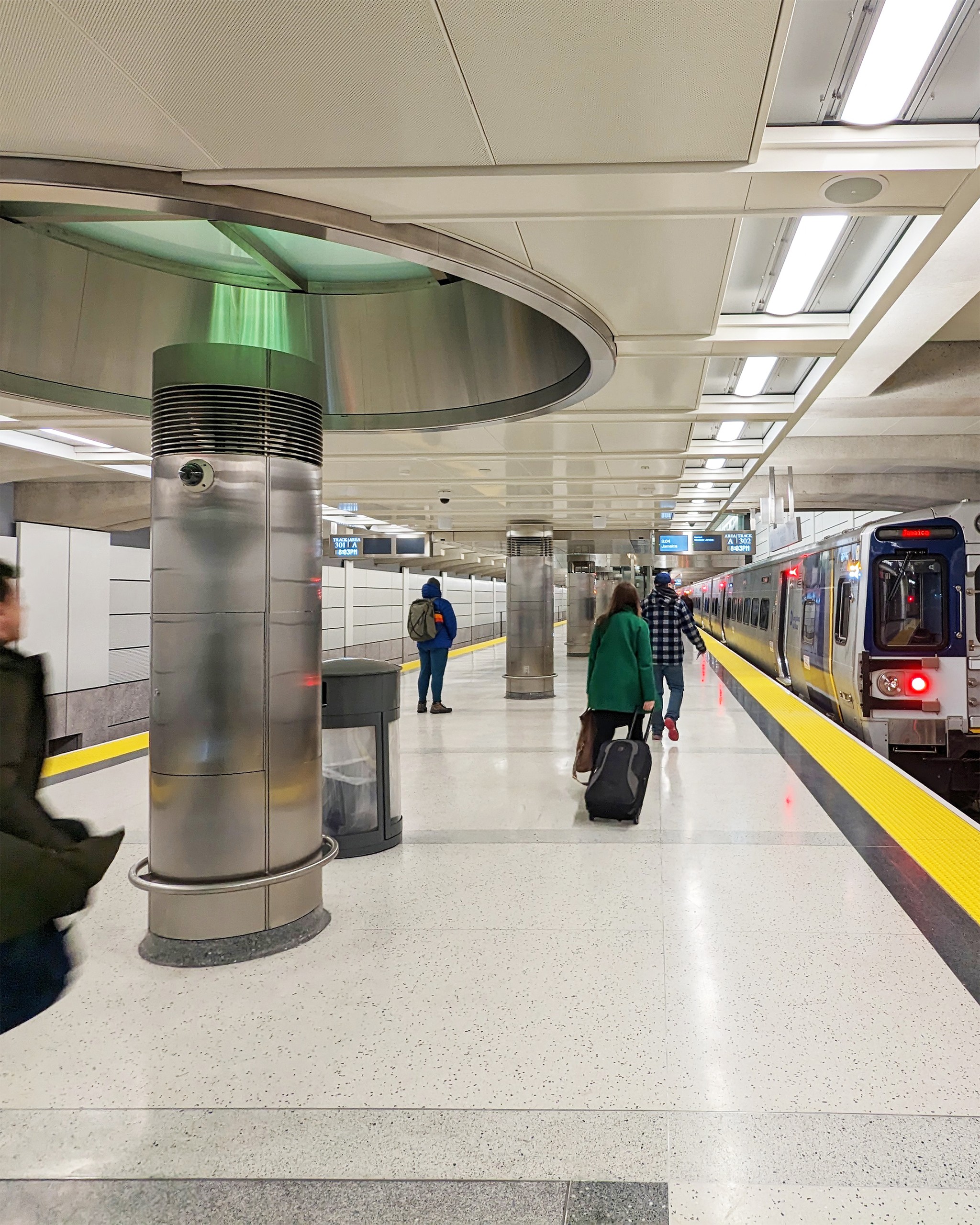 passengers boarding train at platform